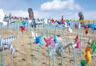 Photo of pinwheels on the beach